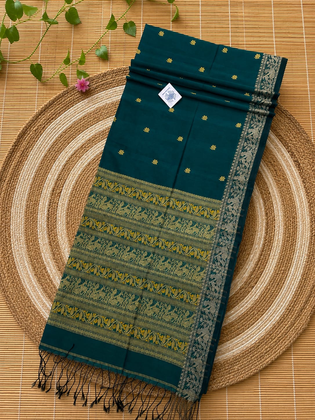 Authentic premium quality handloom Cotton Khadi Baluchuri saree by Rihyaaz, featuring unique traditional Baluchuri-inspired weaving, intricate heritage motifs, elegant handloom texture, breathable cotton khadi fabric and a matching running blouse piece, showcasing timeless Indian craftsmanship and refined ethnic elegance.