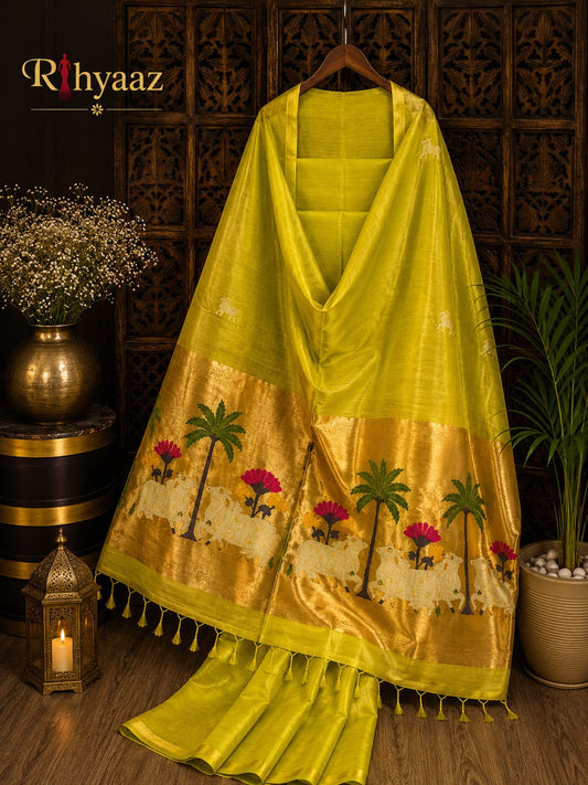 Kamdhenu Silk Linen Pichwai Motif Paithani Jamdani Saree by Rihyaaz featuring intricate Pichwai-inspired weaving, elegant Paithani pallu, handcrafted details, and a plain blouse piece for festive and traditional wear.