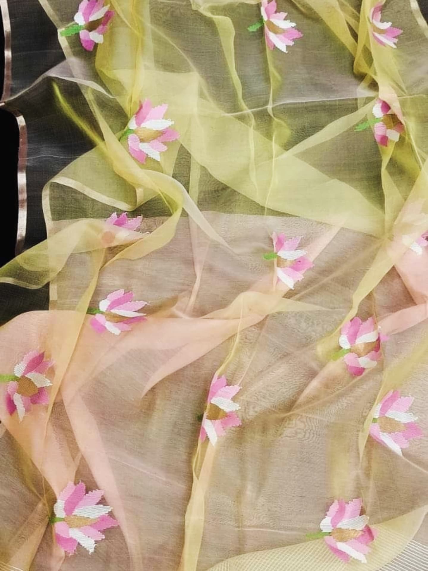 Nalina - Muslin Needle Jamdani Lotus Saree by Rihyaaz featuring handwoven lotus motifs on soft muslin fabric with intricate needle Jamdani craftsmanship.