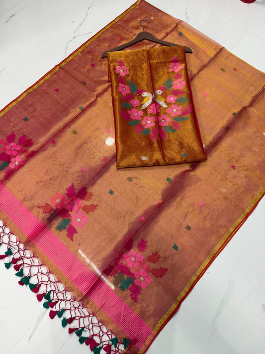 Kaveri Rust Tissue Kora Needle Jamdani suit by Rihyaaz featuring delicate Jamdani weaving and elegant traditional detailing.