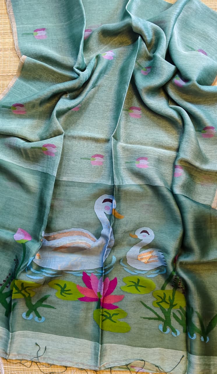 Morali slate pure silk Jayshree linen saree with sleek zari border, handwoven Jamdani resham palla and delicate lotus motifs all over the body, with running blouse piece by Rihyaaz Fashions.