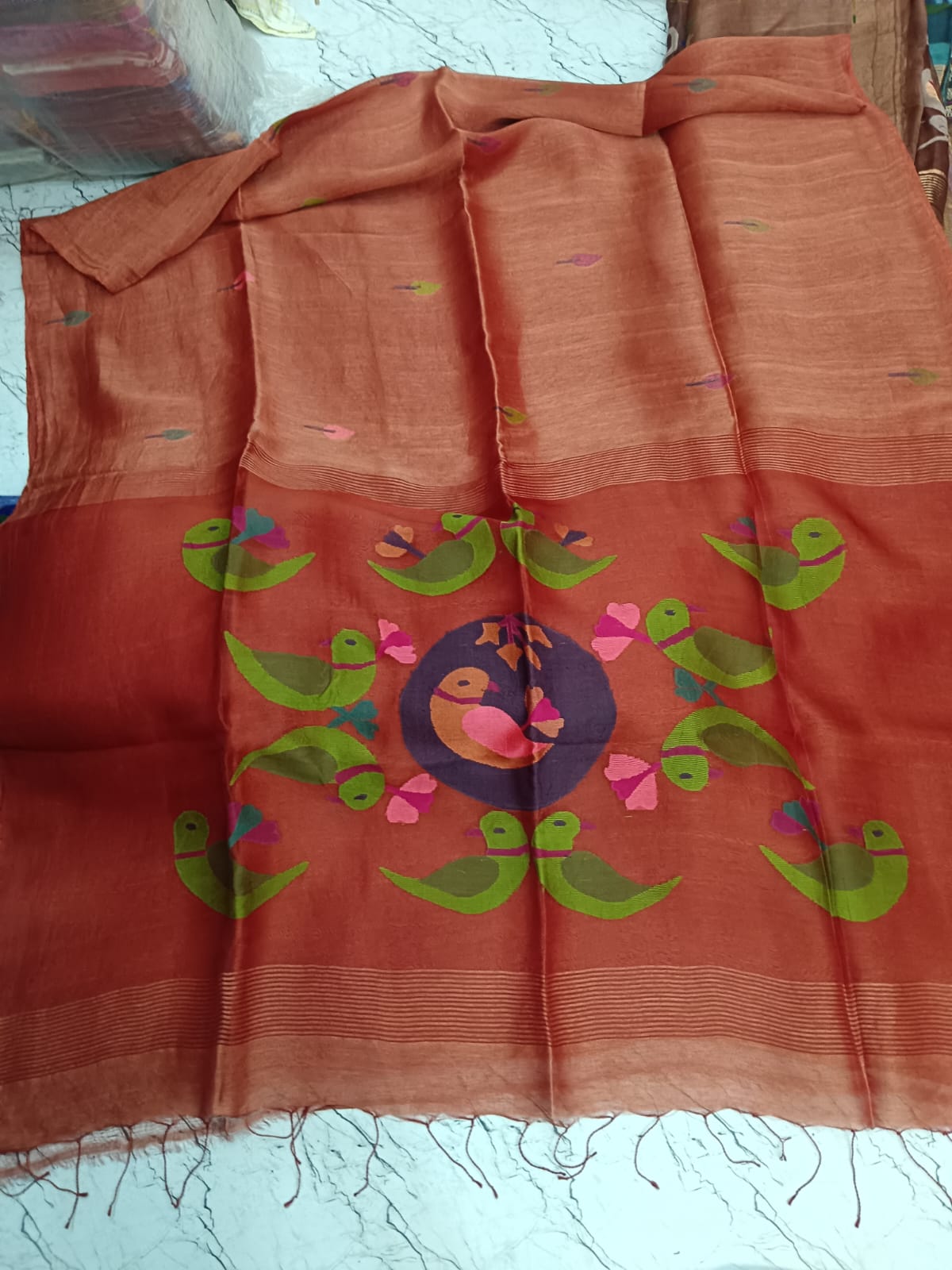 Parrot - Silk Linen Needle Jamdani Weaved Saree from Rihyaaz, crafted with delicate Jamdani-inspired needle weaving and parrot motiffs. Its lightweight silk-linen texture and refined detailing make it an elegant choice for festive occasions, celebrations, and sophisticated everyday dressing.