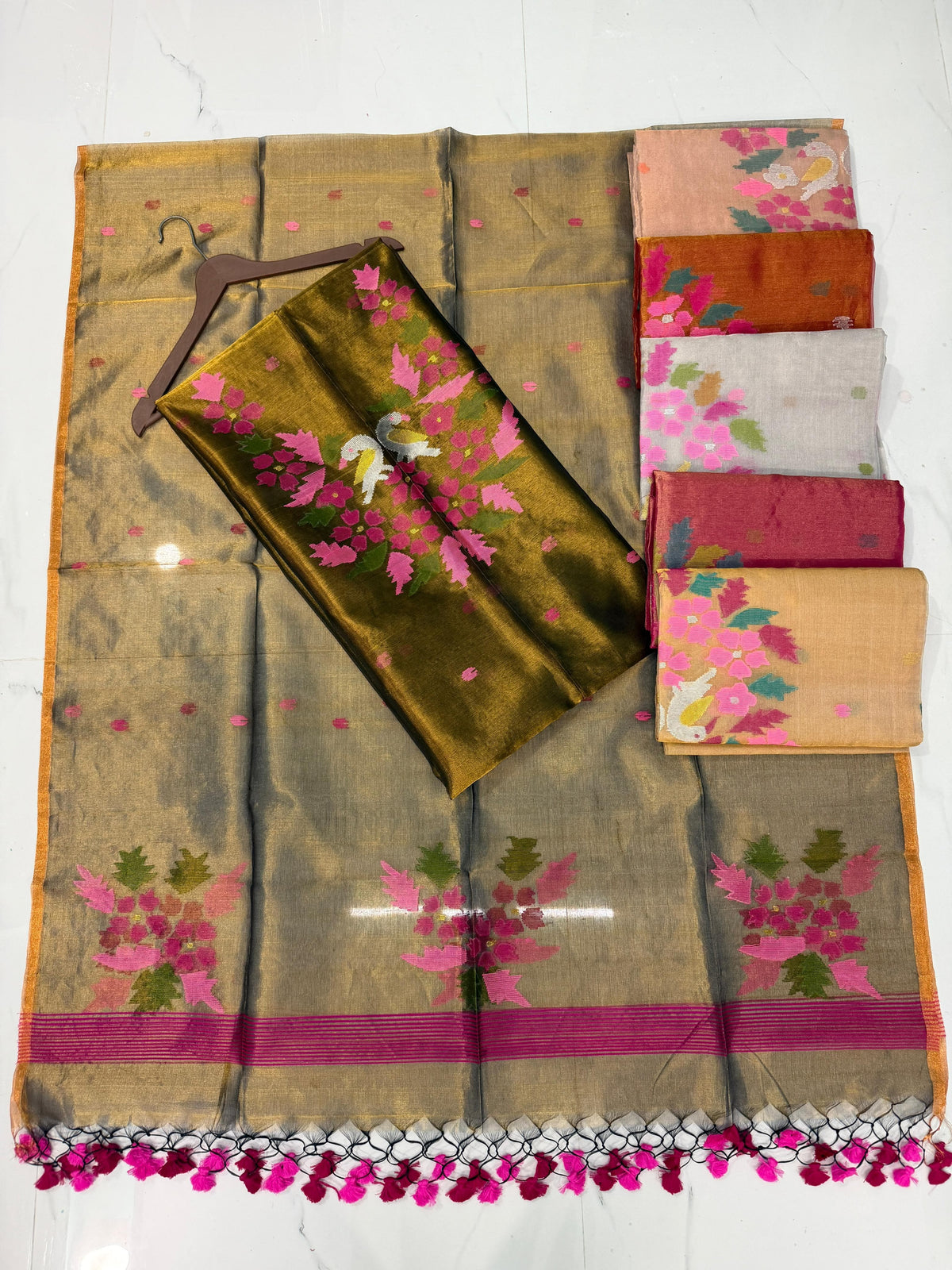 Kaveri Tissue Kora Needle Jamdani suit by Rihyaaz featuring delicate Jamdani weaving and elegant traditional detailing.