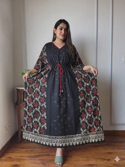 Woman wearing an authentic Ajrakh hand block printed long cotton kaftan in natural dyes