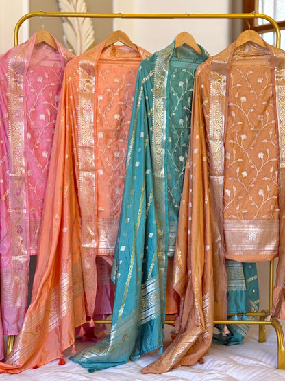 Exclusive Banarasi raw mango silk unstitched salwar kameez with zari-woven top, woven silk dupatta and Silk Katan bottom by Rihyaaz.