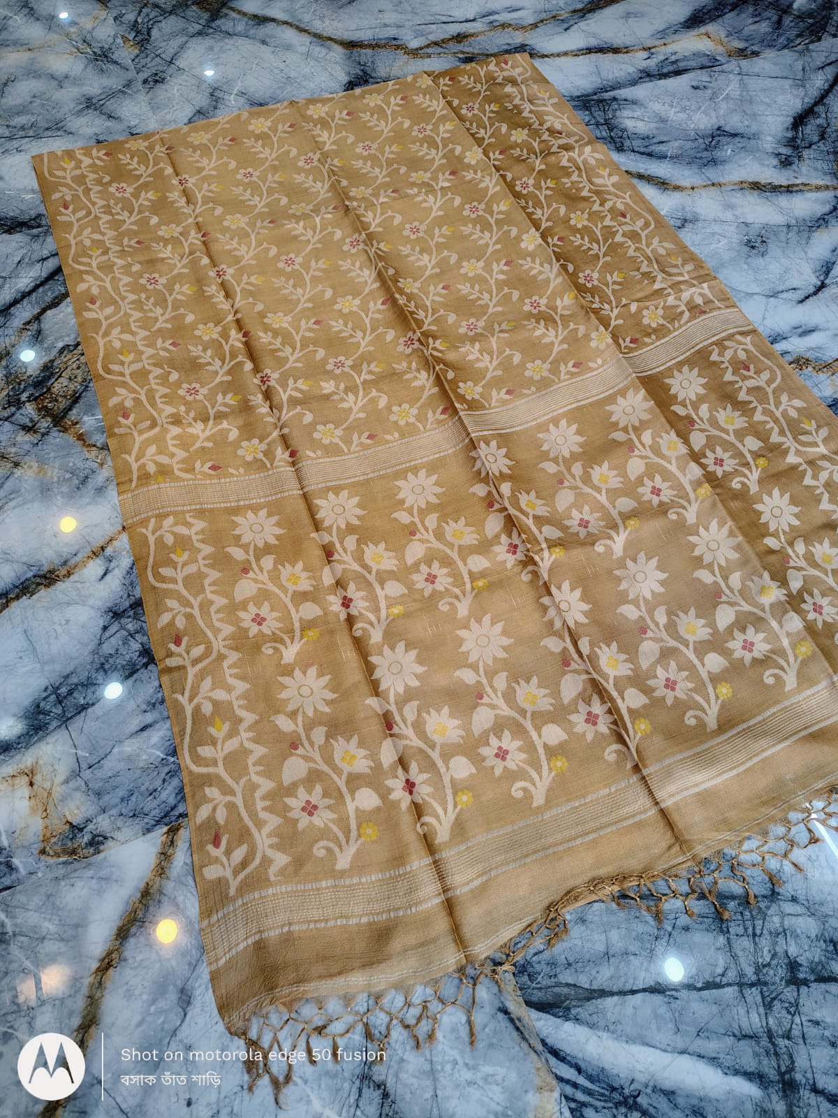 Silkmark certified Beige Bengal handloom Tussar tie and dye Allover Floral motif saree with an all-over tie-dye pattern, elegant contrast border, and blouse piece Exclusively by Rihyaaz.