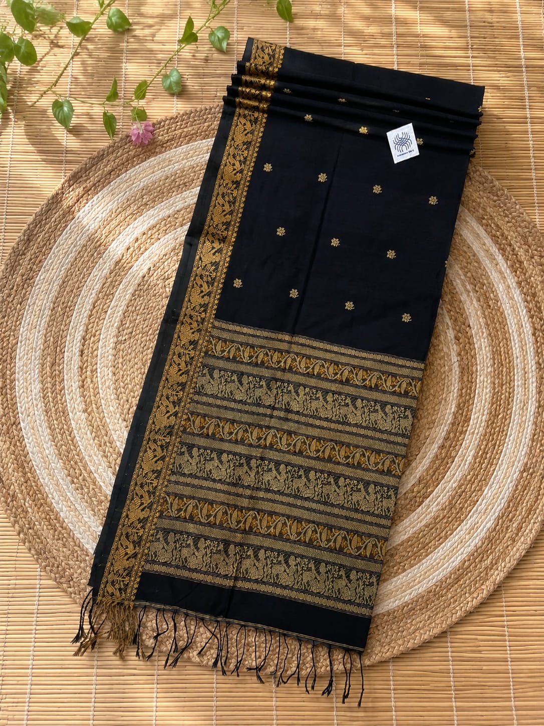 Authentic premium quality handloom Cotton Khadi Baluchuri saree by Rihyaaz, featuring unique traditional Baluchuri-inspired weaving, intricate heritage motifs, elegant handloom texture, breathable cotton khadi fabric and a matching running blouse piece, showcasing timeless Indian craftsmanship and refined ethnic elegance.