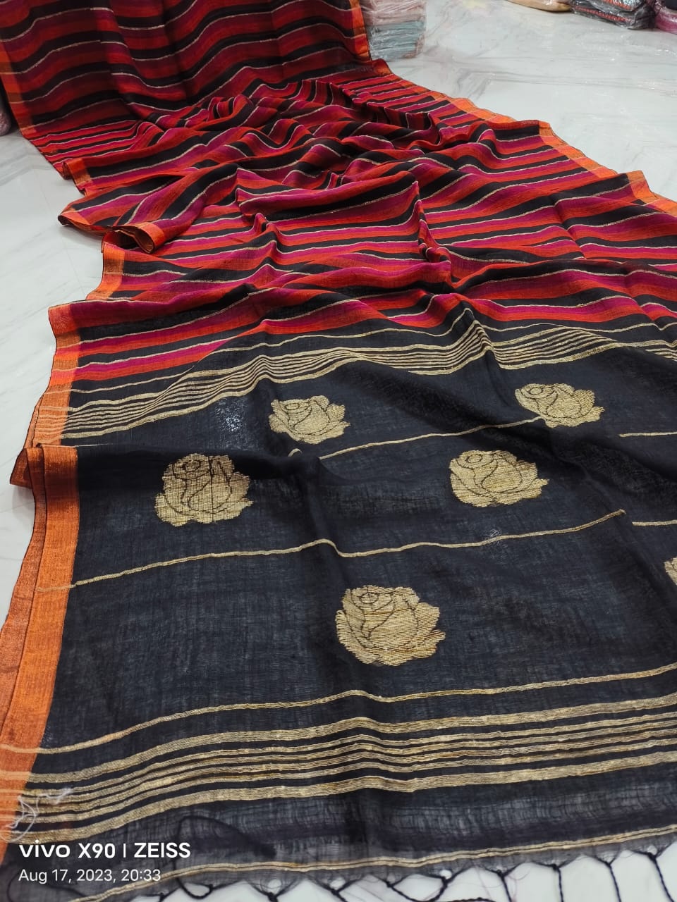 Rose handwoven striped linen saree with elegant woven stripes, rose motifs, and a lightweight traditional handloom texture by Rihyaaz 