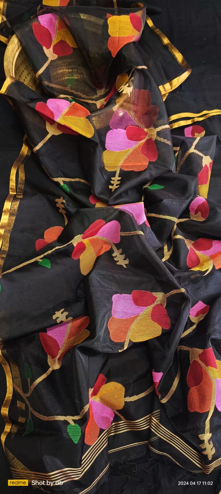 Blossom muslin Jamdani saree with allover floral handwoven motifs by Rihyaaz