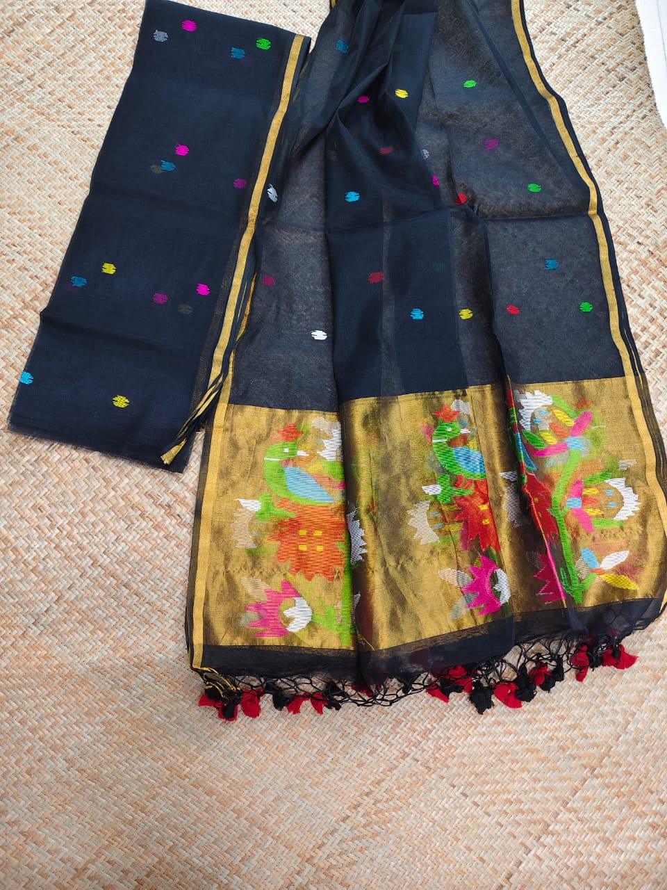 Morni black premium muslin tissue suit with intricate needle work Jamdani palla Peacock Motif dupatta by Rihyaaz.