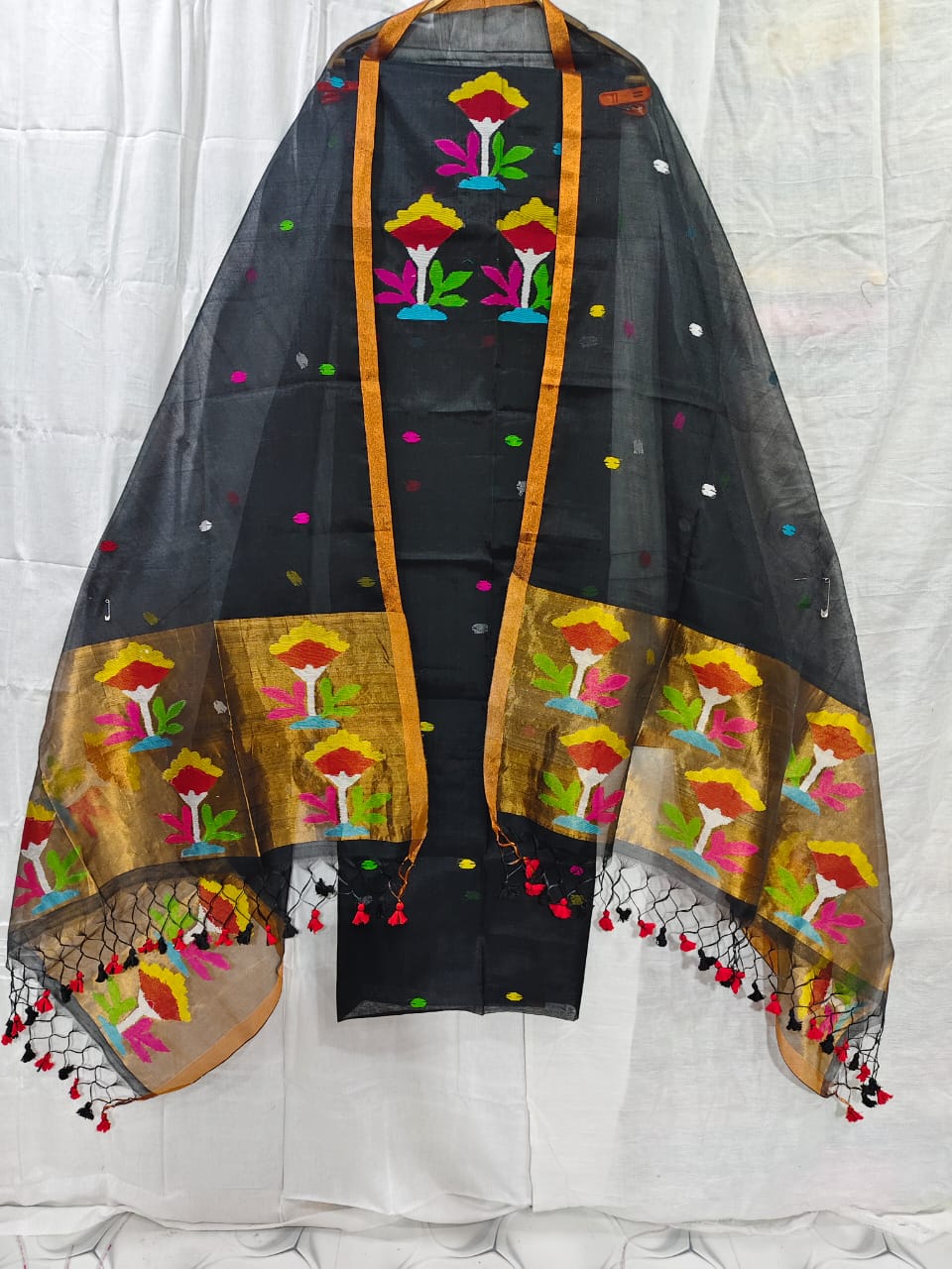 Rihyaaz muslin suit with 2.5 meter top and tasselled 2.5 meter dupatta, elegant ethnic Indian wear.