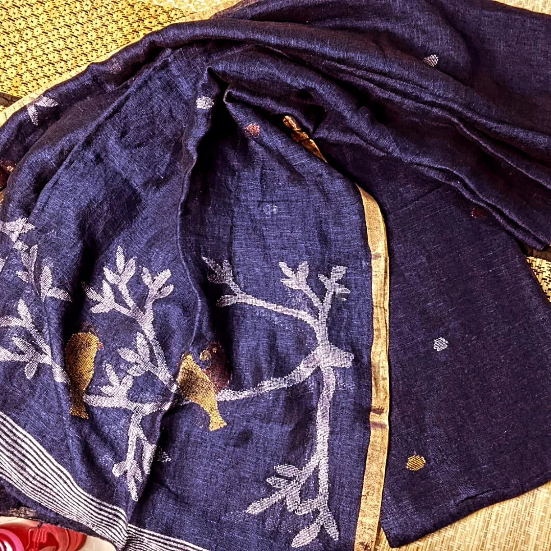 Panchchi - Dual Zari Bird Weaved Linen Jamdani Suit by Rihyaaz featuring handwoven premium linen fabric with intricate dual zari bird motifs and traditional Jamdani weaving, ideal for festive and ethnic occasions.
