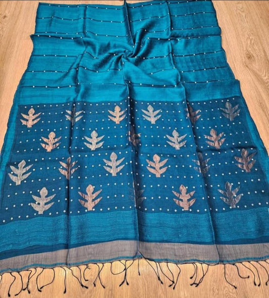 Taru Matka Muslin Silk saree with gold and silver zari motifs on pallu and white sequin sea-shell weave on body and palla by Rihyaaz