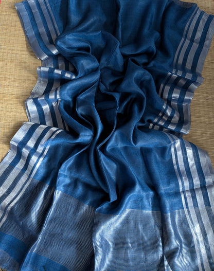 Blue Pure 100-count Jayashree linen saree with tested zari double border on both sides and zari palla, including running blouse piece from Rihyaaz Fashions.