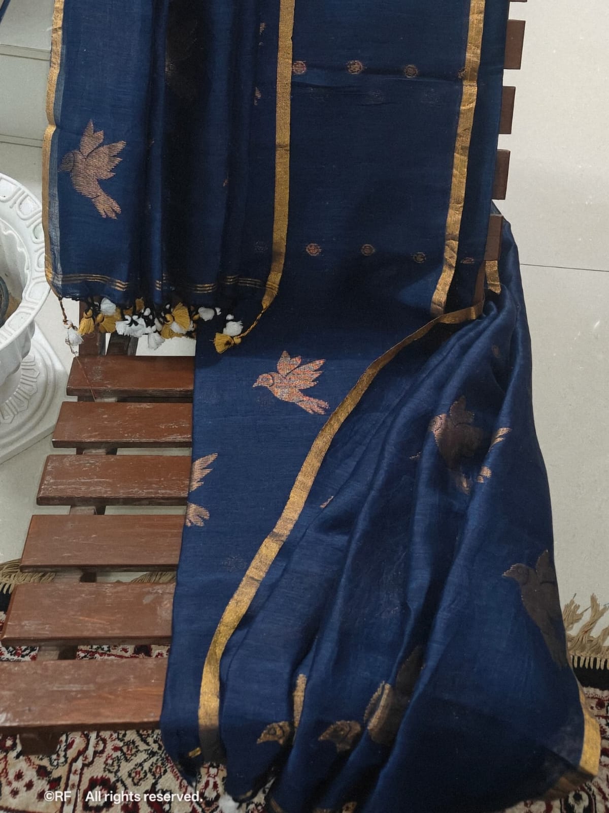 Chorui silk linen zari-weaved suit featuring intricate traditional bird motifs with a 2.5-meter top and 2.5-meter dupatta by Rihyaaz.