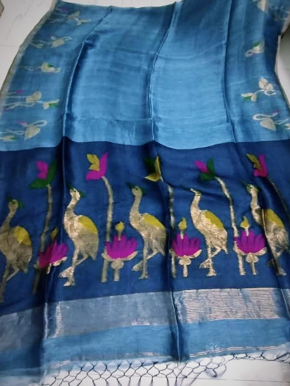 Pelican - Silk Linen Tissue Saree by Rihyaaz featuring premium handwoven silk linen tissue fabric with an elegant sheen, lightweight drape, and luxurious festive design for weddings and celebrations.