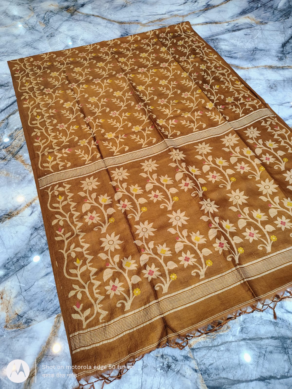 Silkmark certified Brown Bengal handloom Tussar tie and dye Allover Floral motif saree with an all-over tie-dye pattern, elegant contrast border, and blouse piece Exclusively by Rihyaaz.