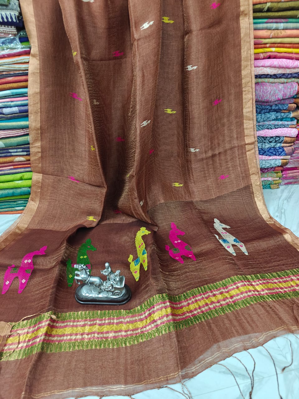Terracotta Linen Silk Saree with intricate Resham woven palla by Rihyaaz, premium handwoven ethnic saree featuring elegant craftsmanship, soft drape, and timeless festive wear for women