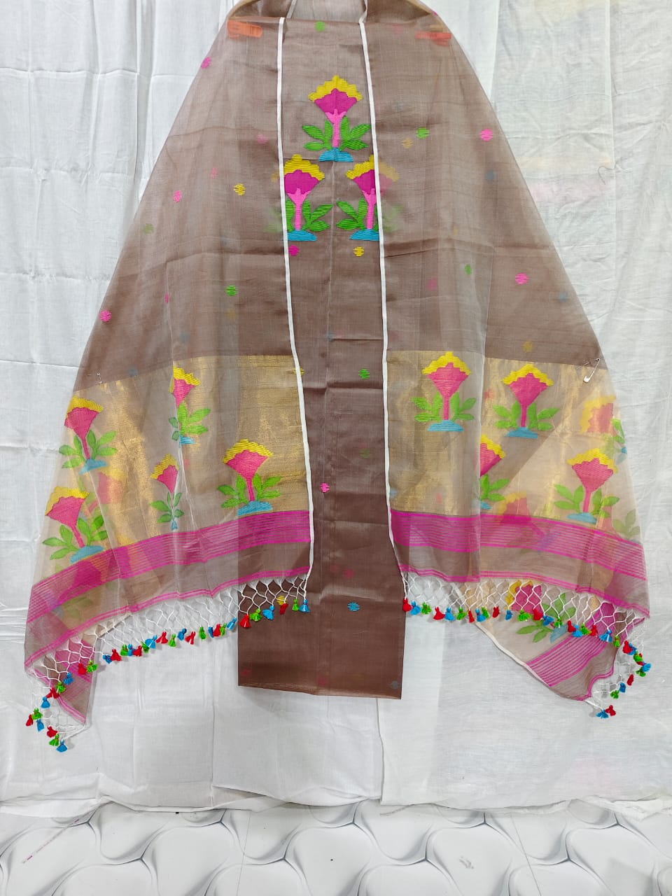 Rihyaaz muslin suit with 2.5 meter top and tasselled 2.5 meter dupatta, elegant ethnic Indian wear.