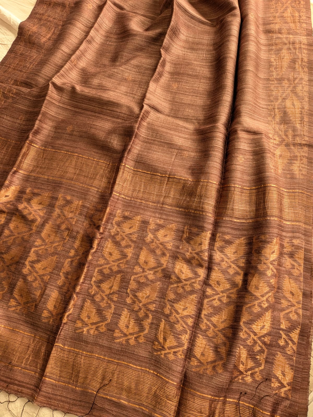 Durga Brown premium-quality Pure Matka Jamdani saree with traditional woven designs and running Matka blouse piece by Rihyaaz Fashions.
