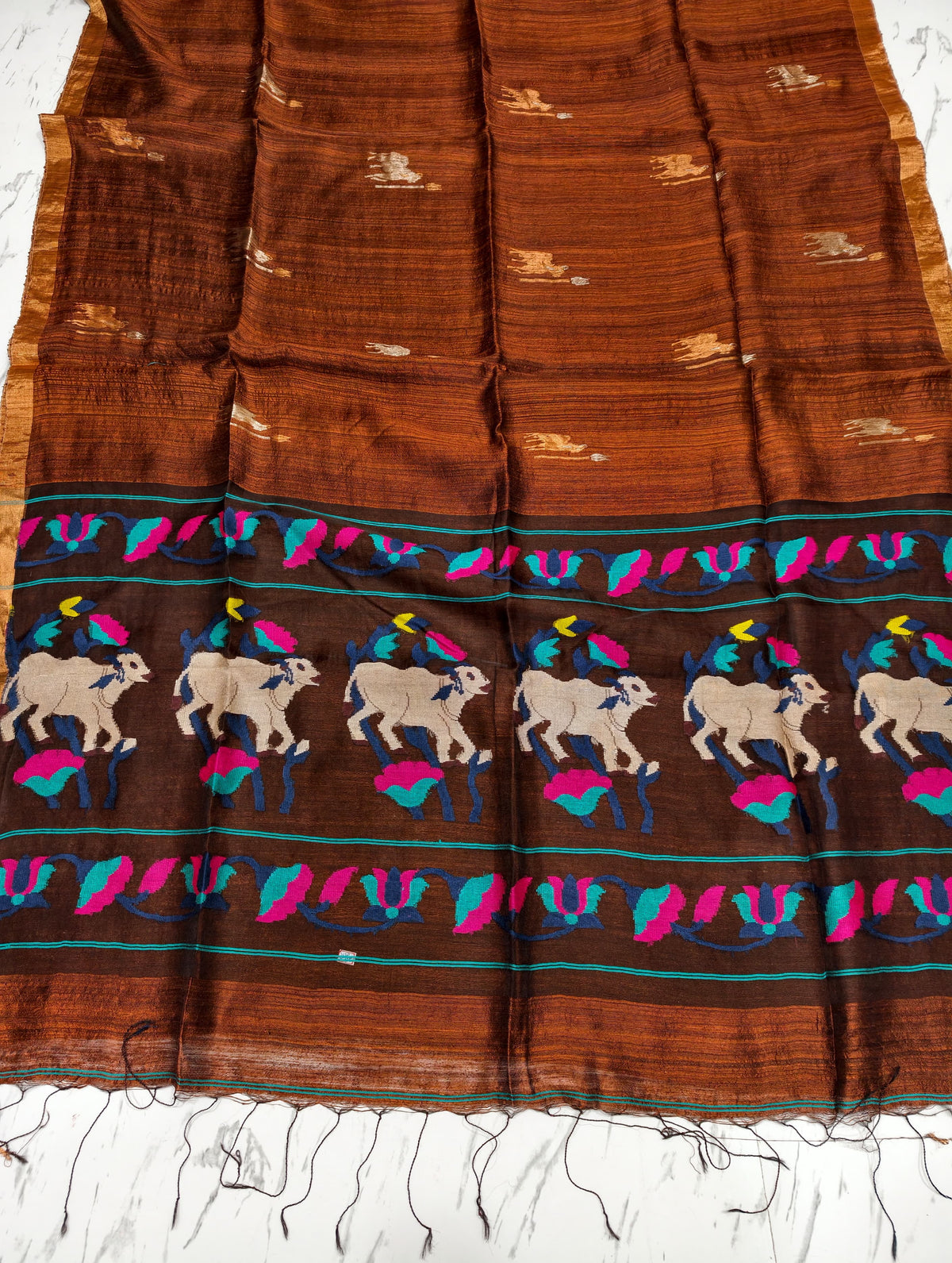 Godan dark brown Pichwai Inspired Pure Motka Muslin saree with beautifully crafted pallu and matching blouse piece, Silk Mark certified by Rihyaaz Fashions.