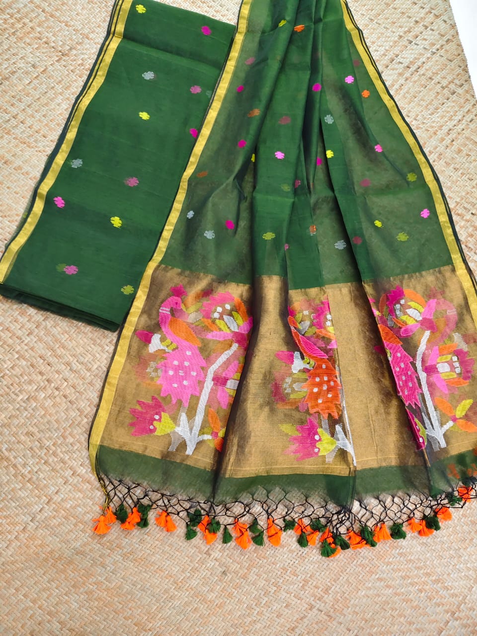 Morni dark green premium muslin tissue suit with intricate needle work Jamdani palla Peacock Motif dupatta by Rihyaaz.