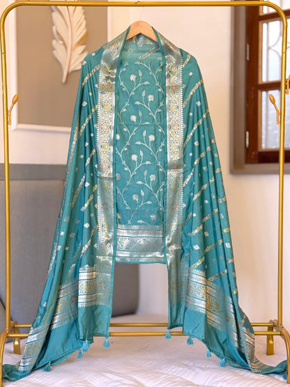 Exclusive Dark sky Banarasi raw mango silk unstitched salwar kameez with zari-woven top, woven silk dupatta and Silk Katan bottom by Rihyaaz.