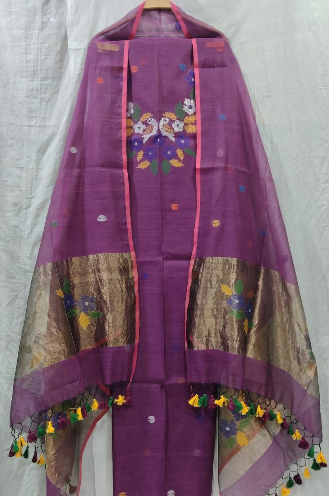 Rihyaaz Muslin Jamdani suit with matching tassel dupatta and delicate needle-weaved floral motifs.