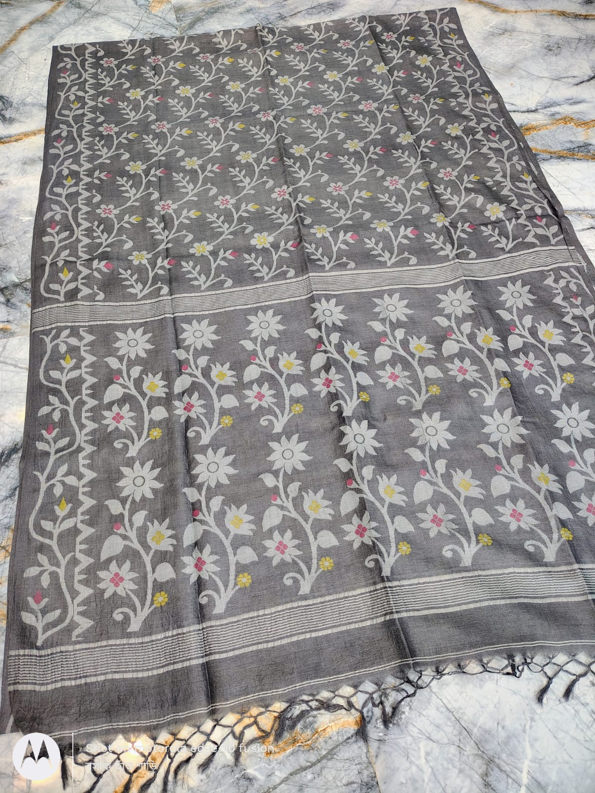 Silkmark certified Gray Bengal handloom Tussar tie and dye Allover Floral motif saree with an all-over tie-dye pattern, elegant contrast border, and blouse piece Exclusively by Rihyaaz.