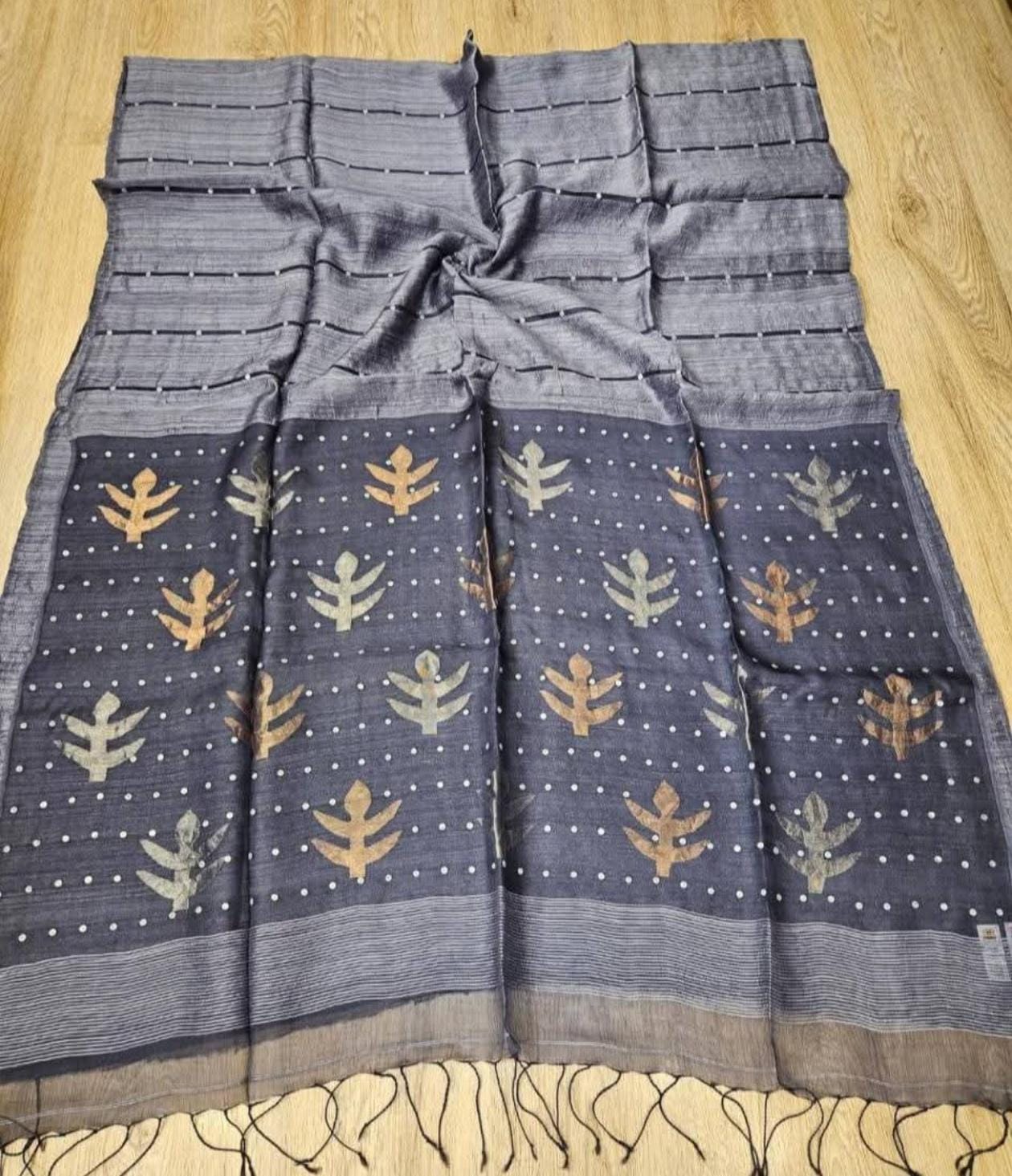 Taru Matka Muslin Silk saree with gold and silver zari motifs on pallu and white sequin sea-shell weave on body and palla by Rihyaaz