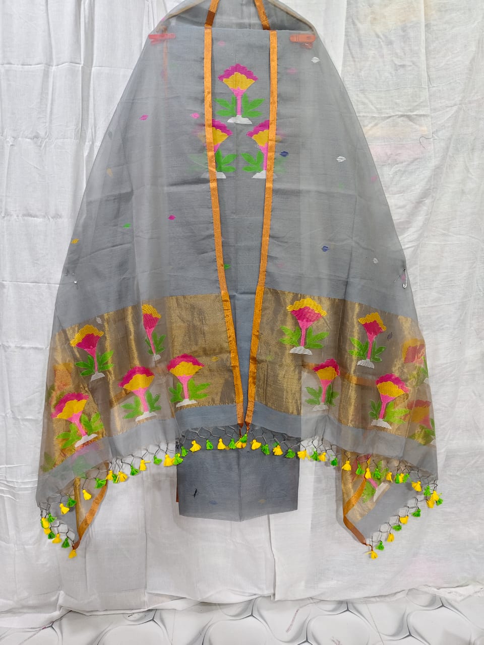 Rihyaaz muslin suit with 2.5 meter top and tasselled 2.5 meter dupatta, elegant ethnic Indian wear.