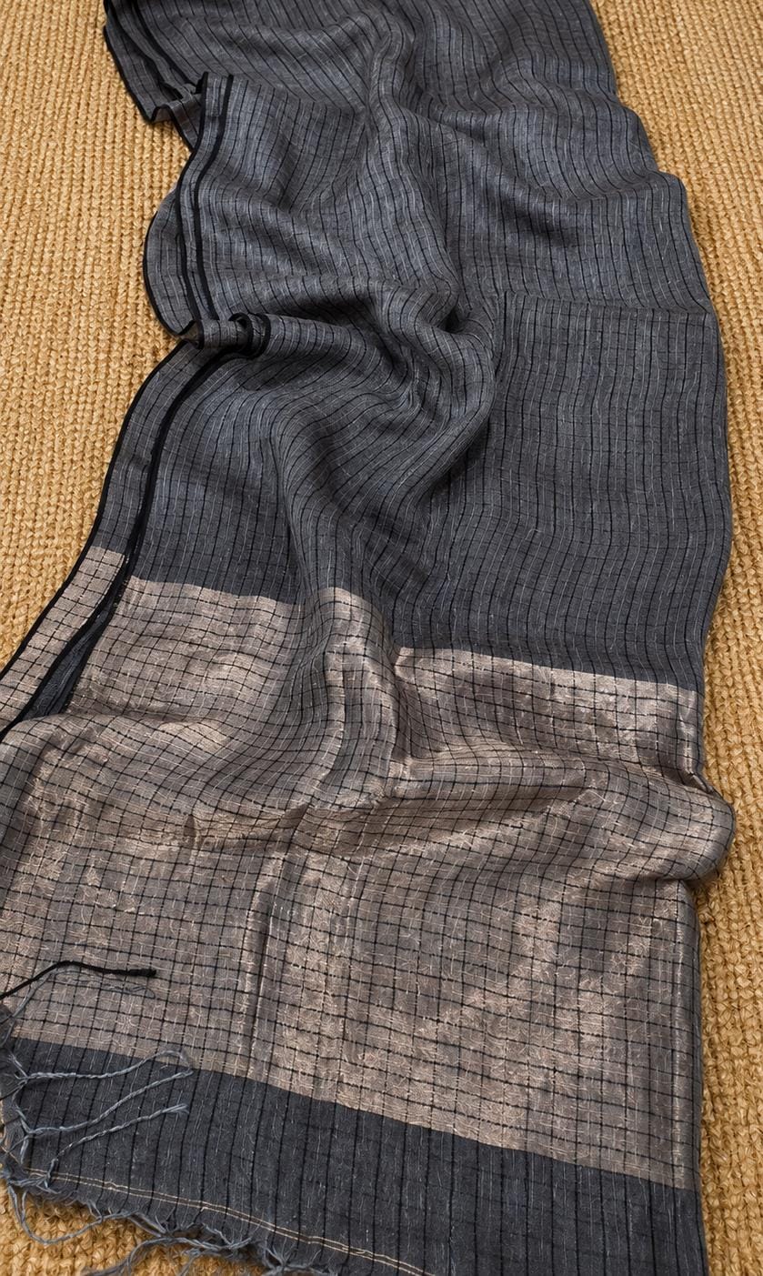 Jaal premium Checkbox Linen saree in Jayashree linen with tested zari tissue palla, sleek black border and blouse piece by Rihyaaz.