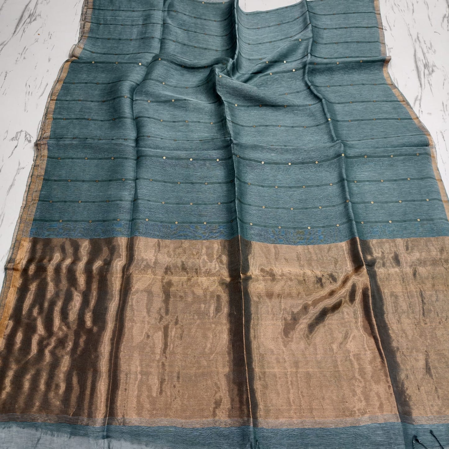 Nakshi Tissue Palla Resham Sequin Weaved Matka Saree by Rihyaaz, featuring elegant traditional weaving and luxurious tissue palla detailing.
