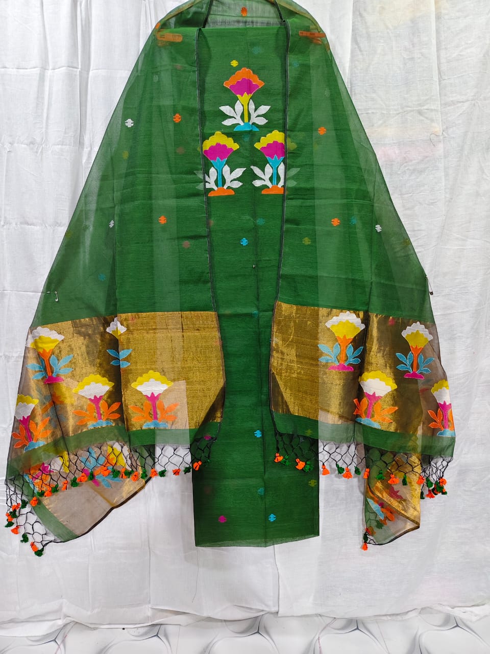 Rihyaaz muslin suit with 2.5 meter top and tasselled 2.5 meter dupatta, elegant ethnic Indian wear.