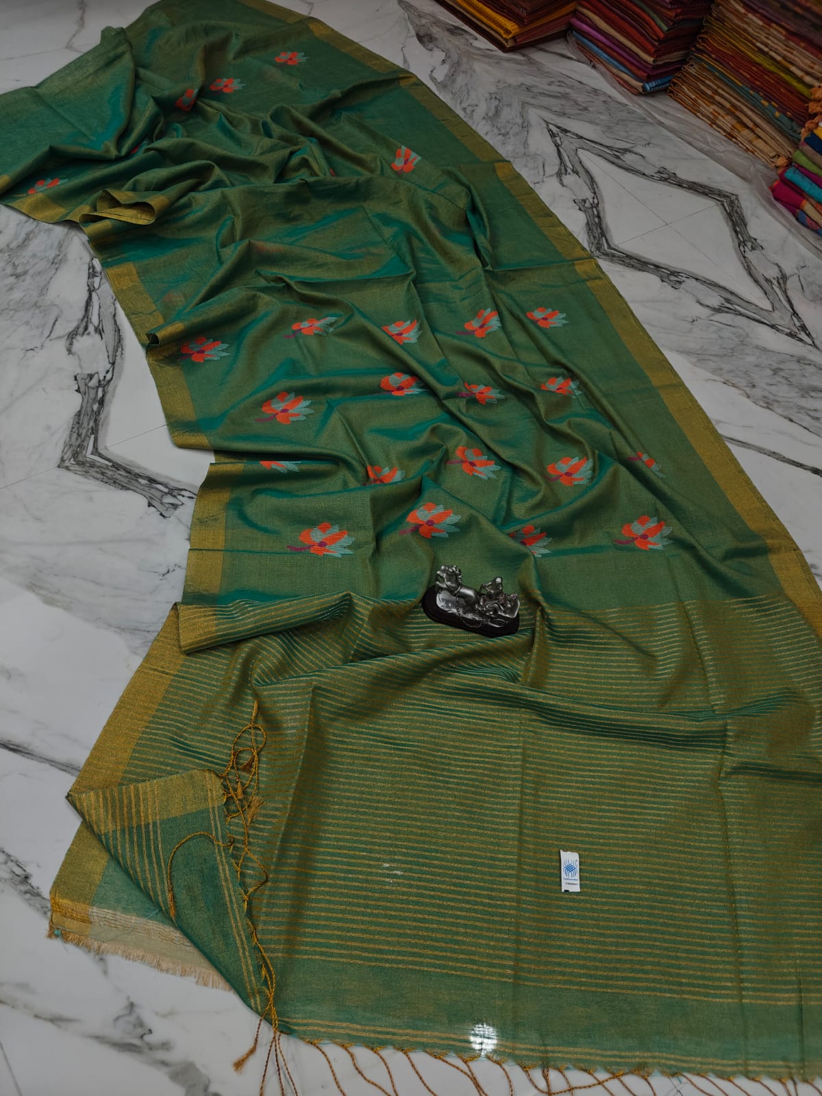 Lolita tissue linen allover weaved floral motiffs needle Jamdani saree with blouse piece, and striped zari weave in Pallu, handcrafted Bengali saree by Rihyaaz