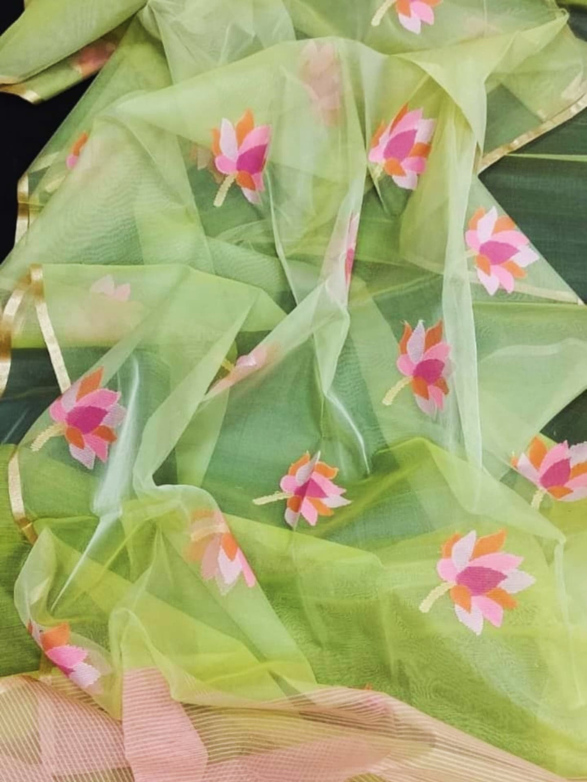 Nalina - Muslin Needle Jamdani Lotus Saree by Rihyaaz featuring handwoven lotus motifs on soft muslin fabric with intricate needle Jamdani craftsmanship.
