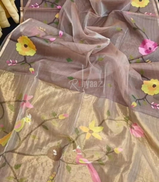 Floral and bird patterned saree with 'Riyaaz' branding.