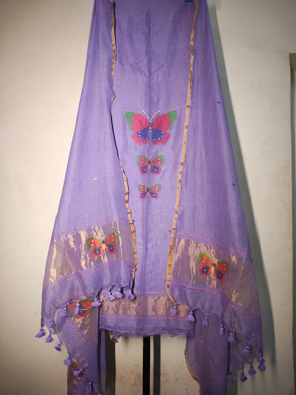 Titli trio zari handwoven Mul Cotton suit with delicate butterfly motifs and elegant zari detailing for a refined royal look by Rihyaaz 
