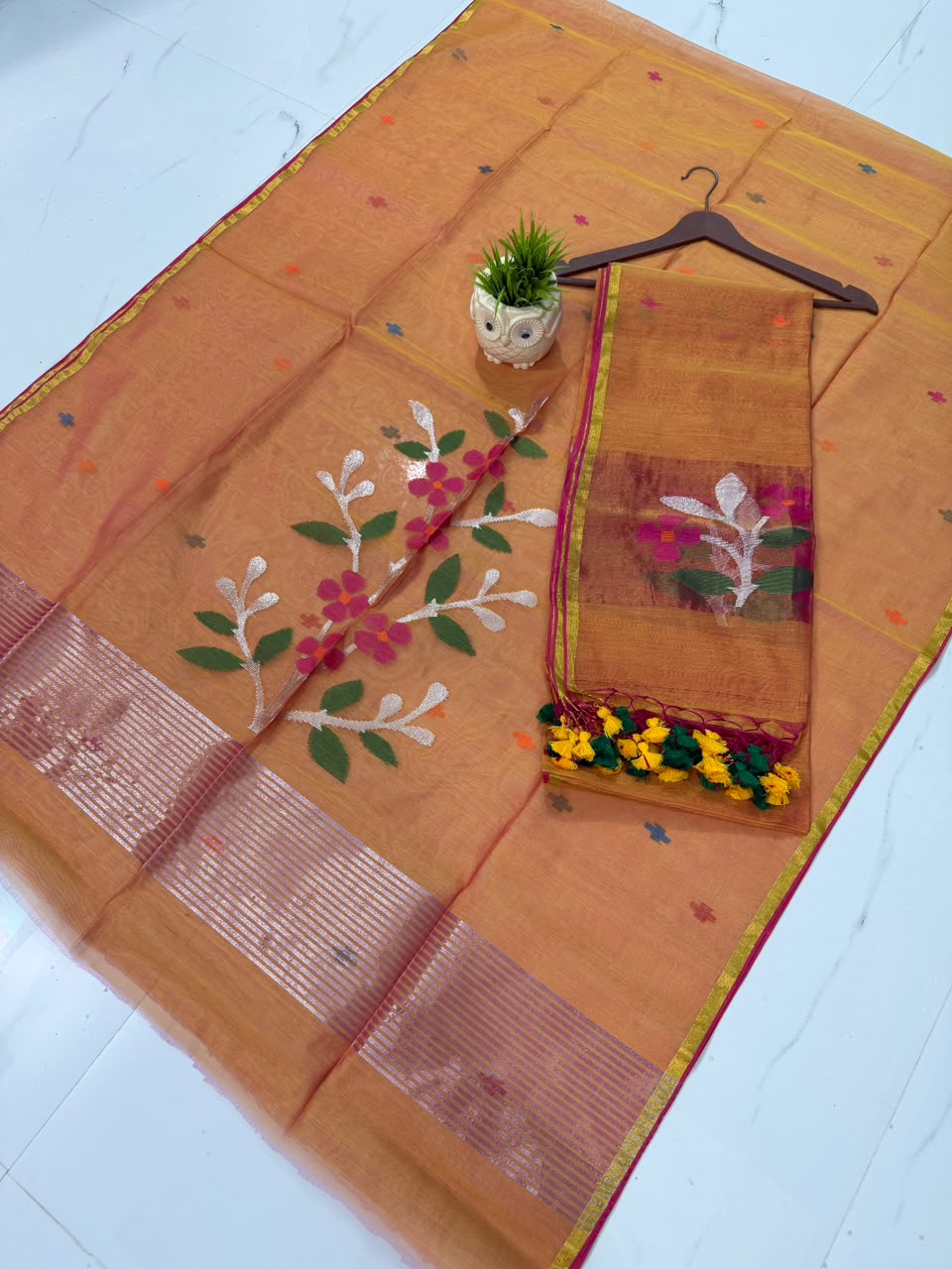 Muslin Jamdani handwoven suit set with 2.5-meter top and 2.5-meter dupatta featuring elegant tassels by Rihyaaz.