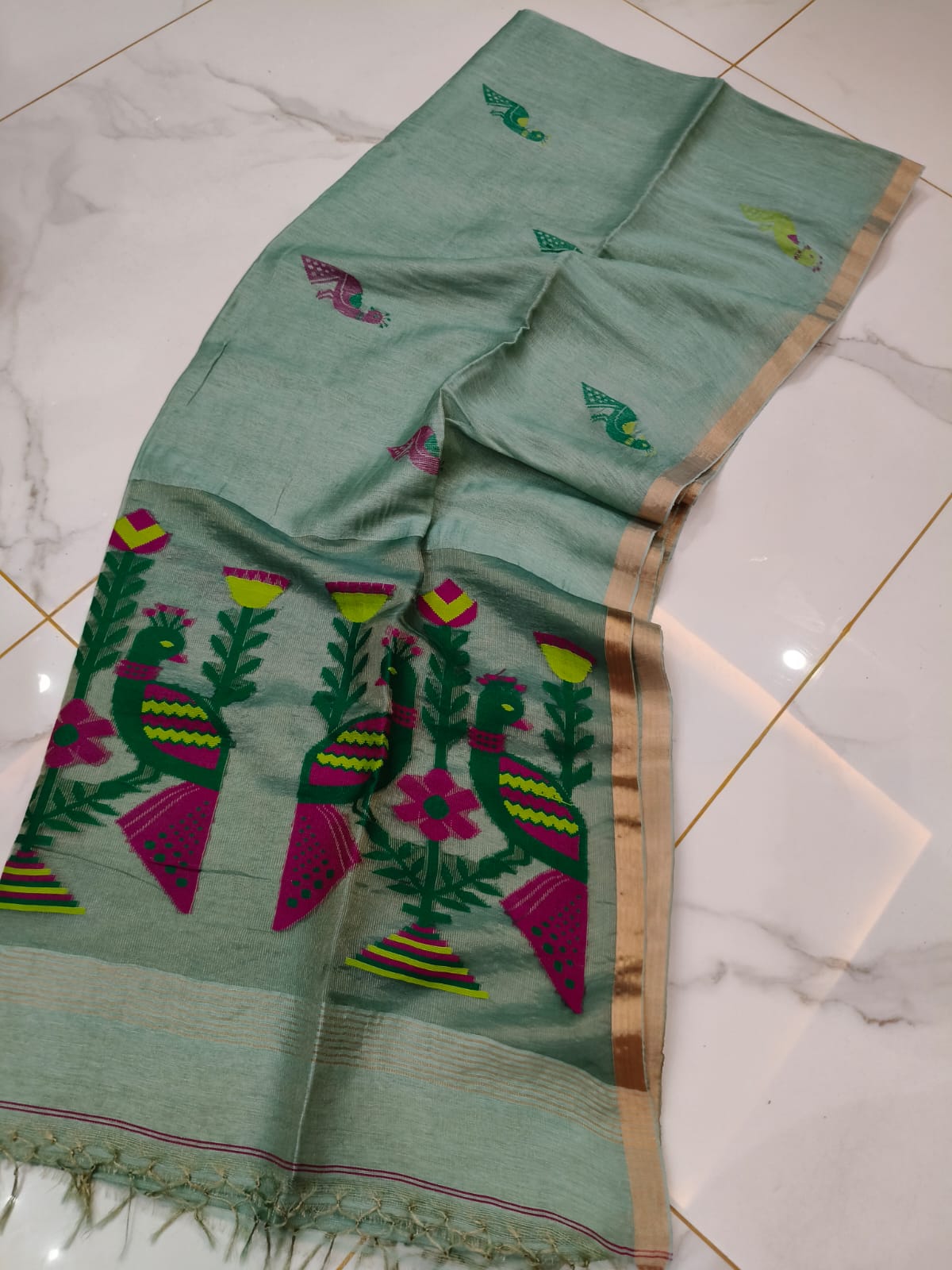Mayur light sage green pure Jayasree linen tissue saree with pure tested zari and Paithani Jamdani work, featuring a running blouse piece by Rihyaaz.