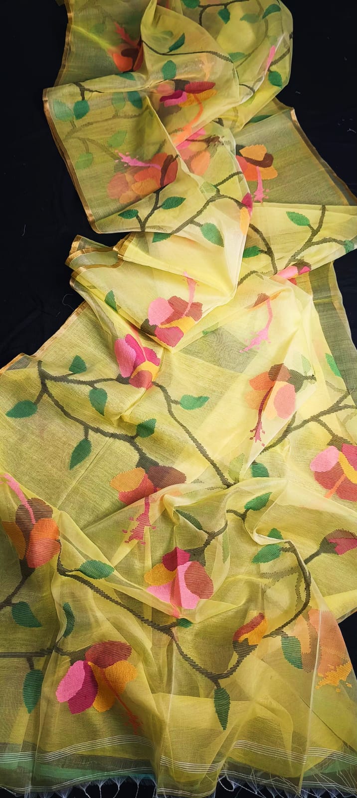 Blossom muslin Jamdani saree with allover floral handwoven motifs by Rihyaaz