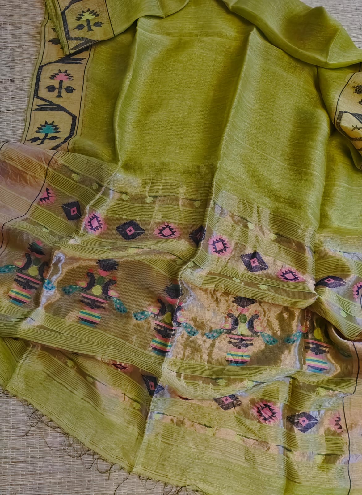 Iravati Light Green exclusive silk linen saree featuring a tested zari Jamdani border, elegant Paithani-style tissue pallu, and matching running blouse piece by Rihyaaz Fashions.