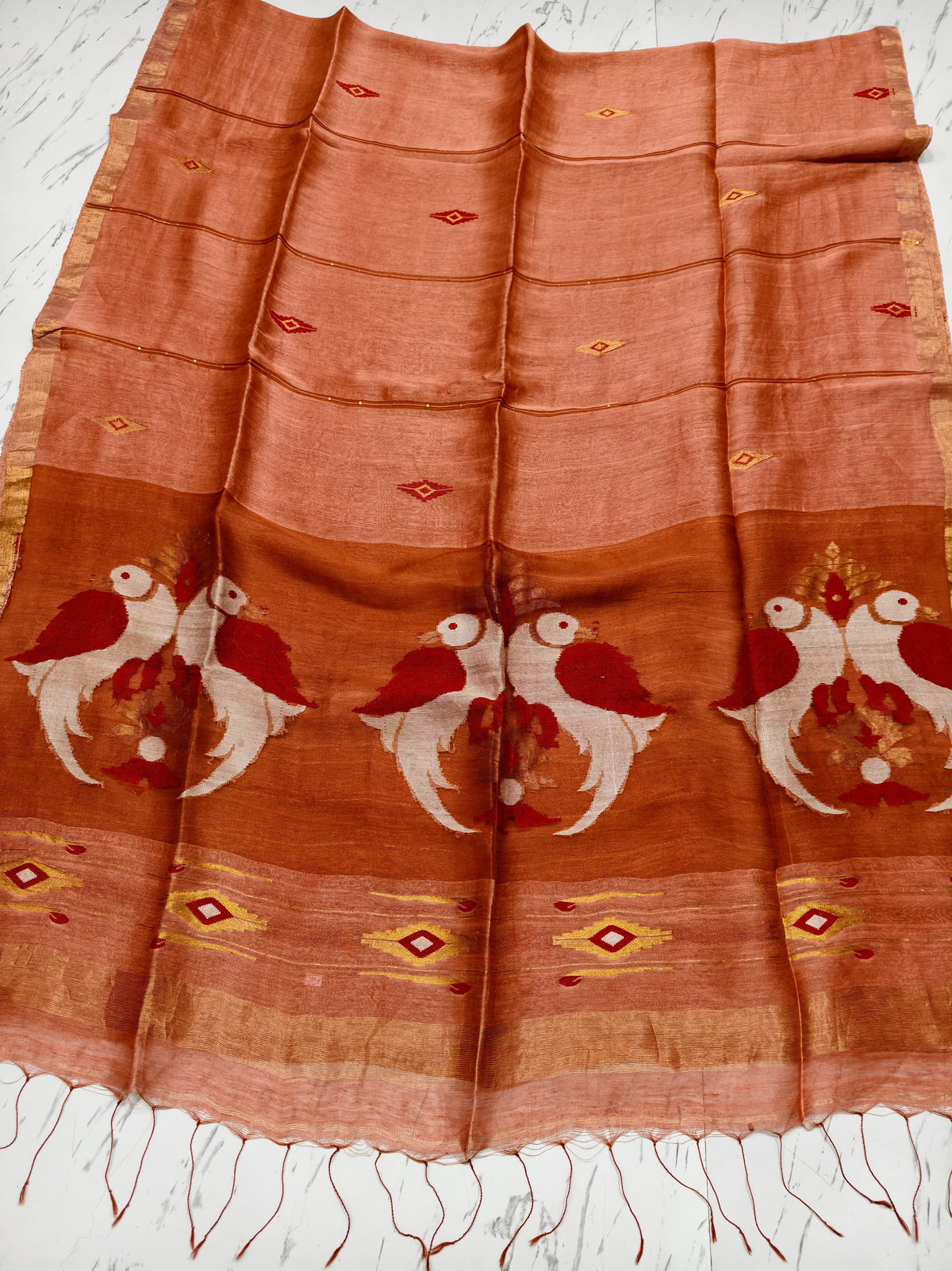 Moyna light Peach silk linen saree with Resham palla and intricate Meenakari Jamdani handwoven detailing with bird motiffs by Rihyaaz