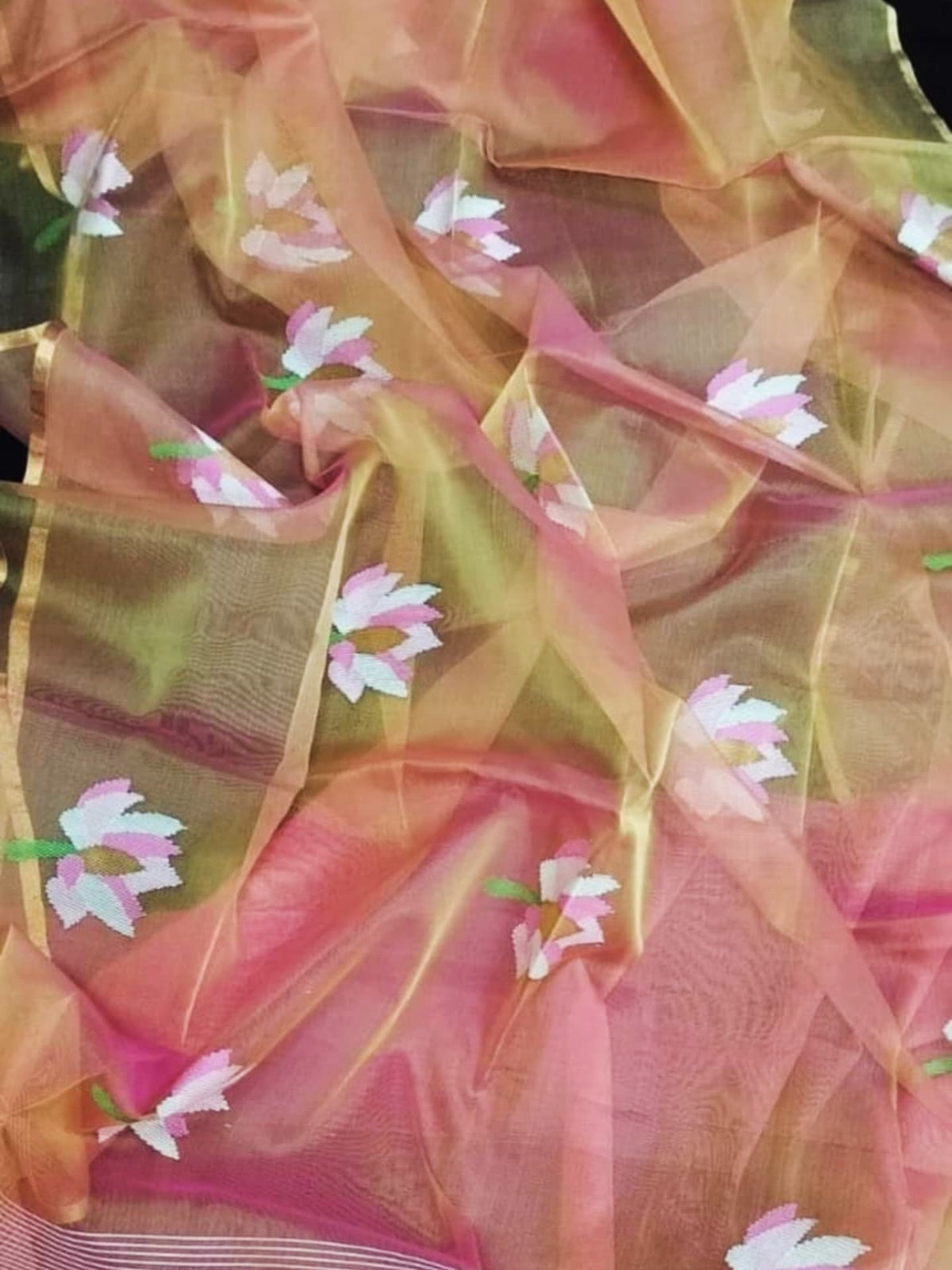 Nalina - Muslin Needle Jamdani Lotus Saree by Rihyaaz featuring handwoven lotus motifs on soft muslin fabric with intricate needle Jamdani craftsmanship.