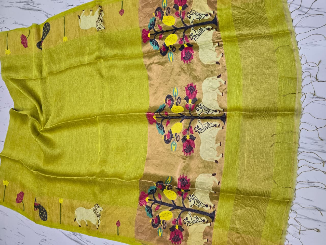 Suravi Silk Linen Pichwai Inspired Jamdani Saree by Rihyaaz featuring intricate handwoven Pichwai-inspired motifs on premium silk linen fabric, ideal for festive, wedding, and ethnic wear.