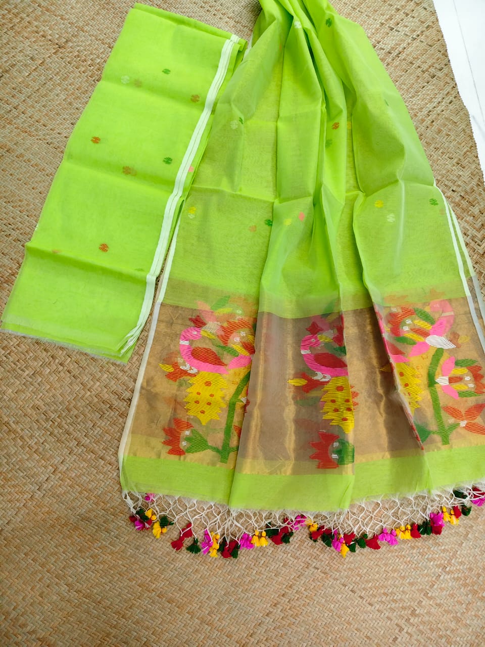 Morni lime green premium muslin tissue suit with intricate needle work Jamdani palla Peacock Motif dupatta by Rihyaaz.