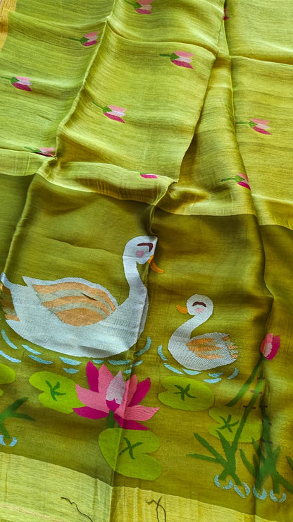 Morali lime green pure silk Jayshree linen saree with sleek zari border, handwoven Jamdani resham palla and delicate lotus motifs all over the body, with running blouse piece by Rihyaaz Fashions.