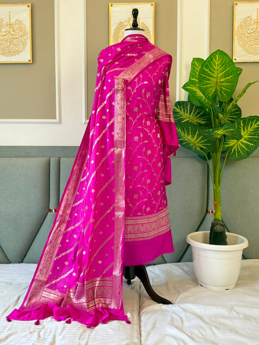 Exclusive Magenta Banarasi raw mango silk unstitched salwar kameez with zari-woven top, woven silk dupatta and Silk Katan bottom by Rihyaaz.