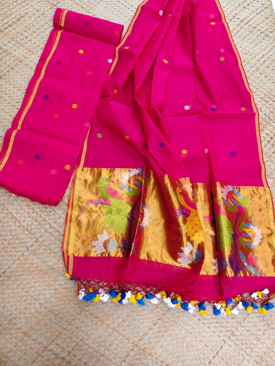 Morni magenta premium muslin tissue suit with intricate needle work Jamdani palla Peacock Motif dupatta by Rihyaaz.