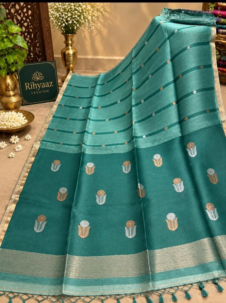 Shop Moss Mint Blue Silk Linen Resham Palla Sona Rupa Dual Zari Weaved Jamdani Saree by Rihyaaz. Handwoven heritage, refined detailing and timeless Indian elegance.